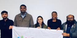 The ESN Iceland Board 2026/2027 holding the ESN flag